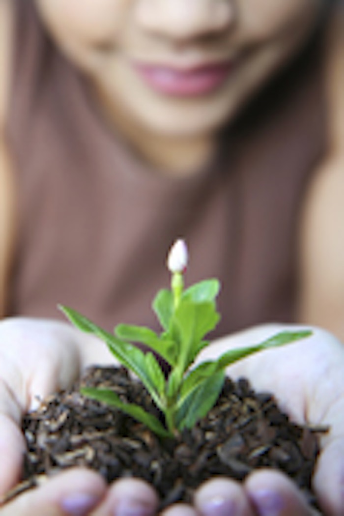 Girl holding a new flower