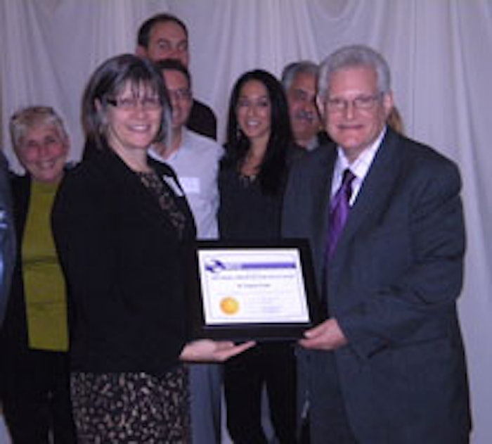 Frank receives the Stanley Allured Lifetime Service Award from Janet Ludwig, Allured’s daughter and president of Allured Business Media, publisher of Cosmetics & Toiletries, as his family surrounds him in support.