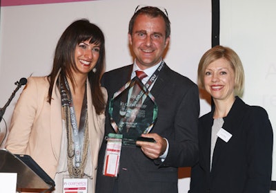 Lucy Gillam, event director, in-cosmetics, (far right) presents Induchem's Parand Salmassinia, general manager, and Fabrice Lefèvre, R&D and marketing director, the Gold award for the 2013 Innovation Zone Best Ingredient.