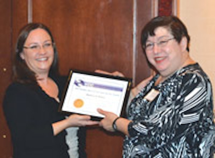 Melissa Tolla (left), PhD, of VVF LLC, presents Barbara J. Morley the 2013 Stanley Allured Lifetime Service Award.