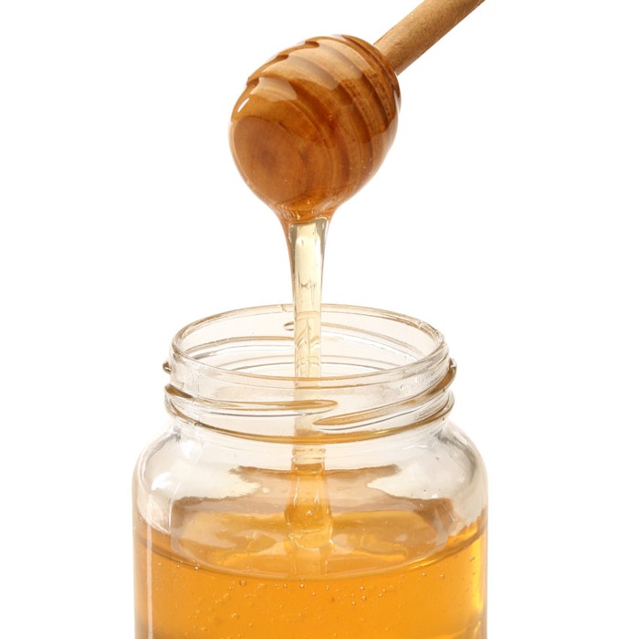 Honey-dollop-into-jar-850