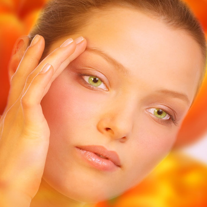 Woman-touching-face-bright-colors-850