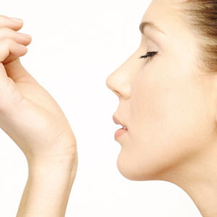 Woman-sniffing-wrist-300