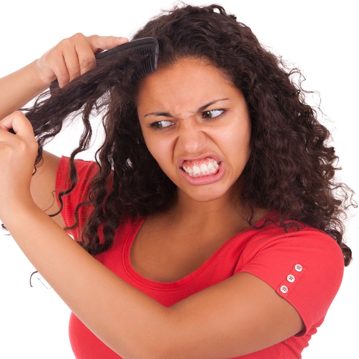 angry-ethnic-lady-combing-hair-850