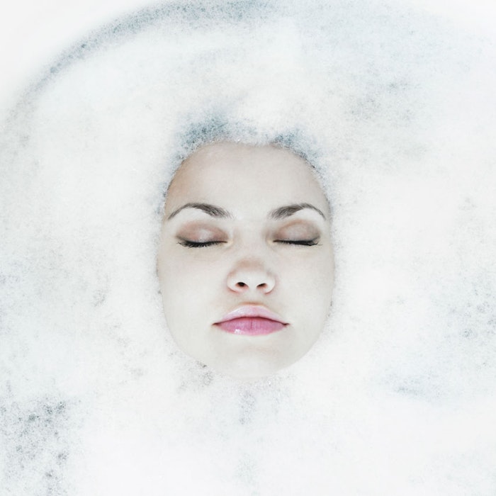 Woman-floating-in-suds-850