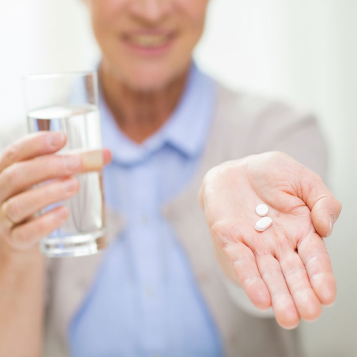 Senior-woman-with-pills