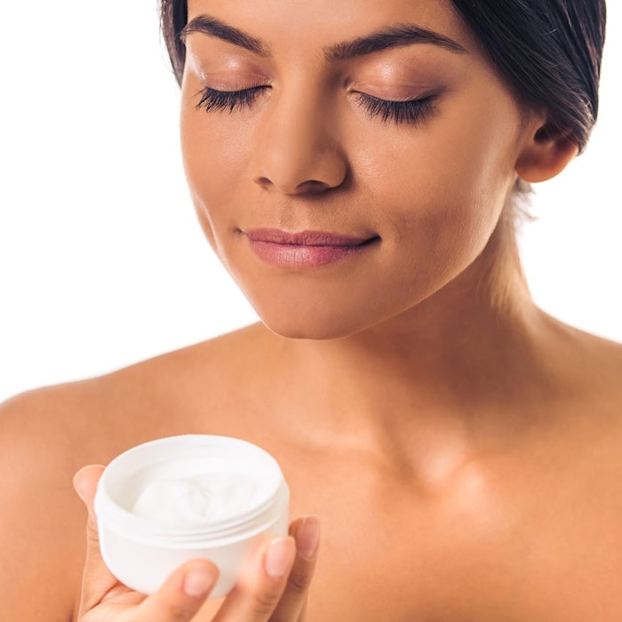 WomanSmellingCream850