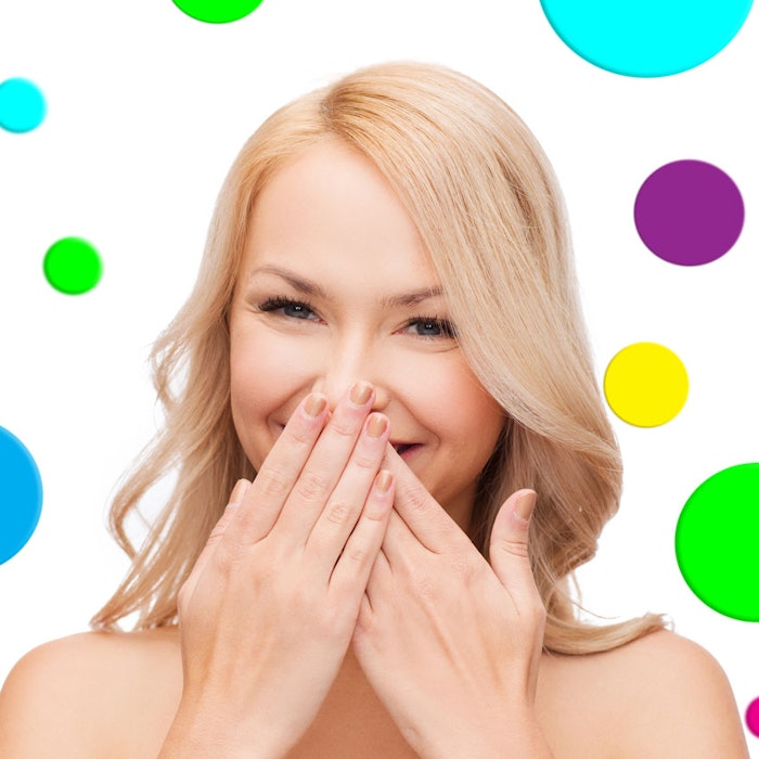 WomanCoveringSmileDots850