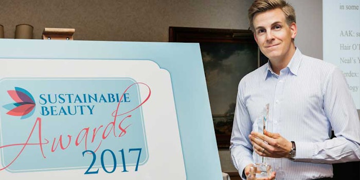 Carsten Jaeger, Global Marketing Director, AAK Personal Care, with the 2017 Sustainable Pioneer Award honouring AAK for its work in West Africa to promote the sustainable sourcing of shea.