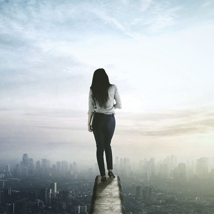 WomanWalkingonLedge850