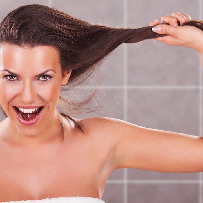 WomanHoldingLongHairOut850
