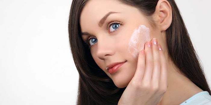 womanrubbingskincarecheek_425