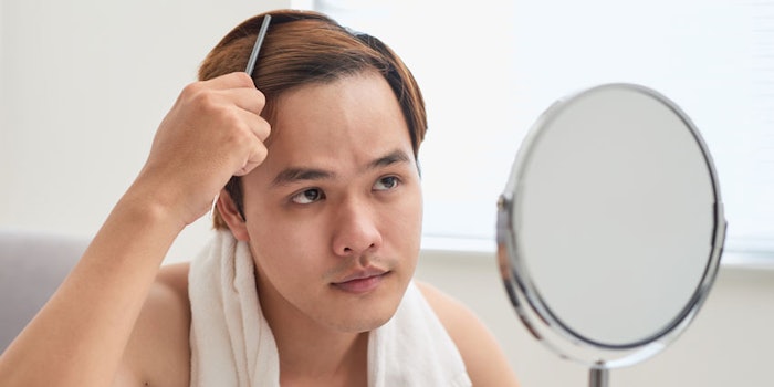 AsianManLookingMirrorHair850x425