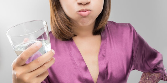 WomanUsingMouthwash850x425
