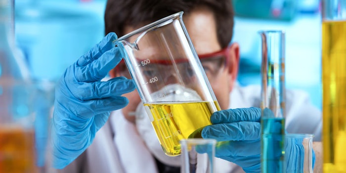 ScientistinLabExaminigBeaker850x425