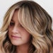 Client with bronde hair and curtain bangs