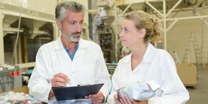 FactoryProductionAuditClipboardtwopeoplediscussion850x425