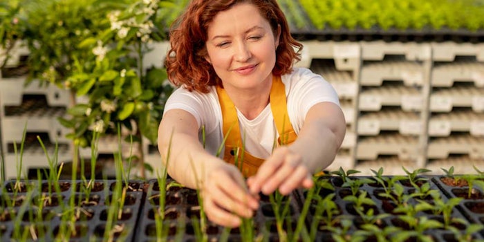 WomaninSmockGreenhouseSprouts850x425