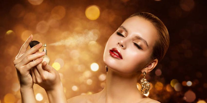 WomanSprayingSparklyFragrance850x425