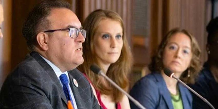 PETA scientist, Amy Clippinger, Ph.D., sits next to EPA administrator, Andrew Wheeler, as he announces the plan to end tests on mammals.