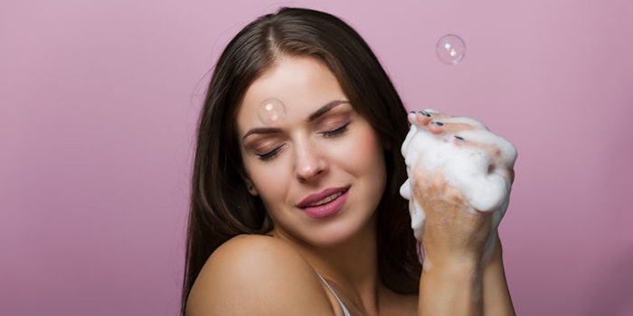 WomanFeelingSmellingSoapBubbles_850x425