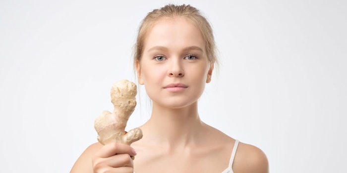 YoungWomanHoldingGingerRoot_850x425