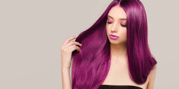 WomanHoldingLookingatPurpleHair_850x425