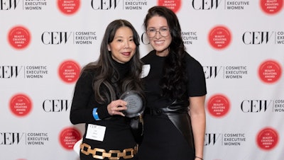 Olaplex CEO Jue Wong and Advent International’s Tricia Glynn with the Hair Shampoo/Conditioner award.