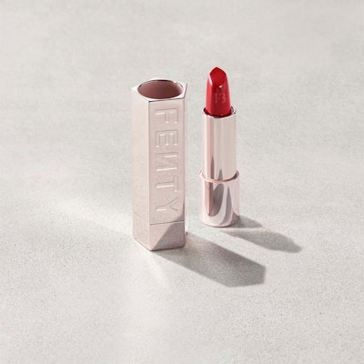 Fenty Icon Semi-Matte Refillable Lipstick—a collection of reds and neutrals in refillable containers.