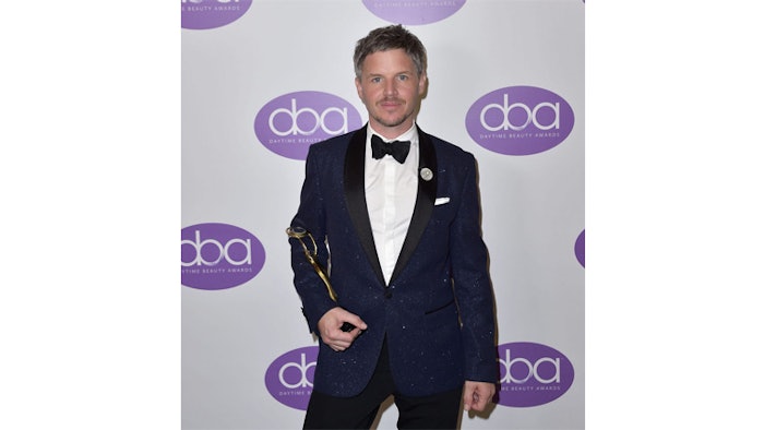 Ben Barkworth holding the Inventor’s Award at this year’s Daytime Beauty Awards (DBA).