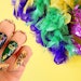 Nailpro shares Mardi Gras nail inspo.