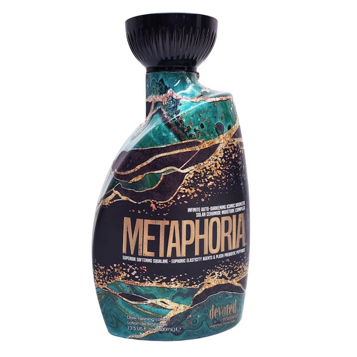 The winning label is a shrink sleeve produced for OL Products' Metamorphia Tanning Lotion. The green, black, and gold marbled packaging design is intended to evoke the product's luxury ingredients.