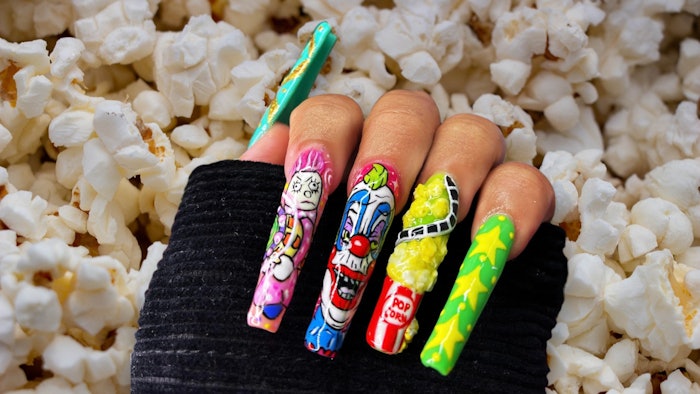 Nail artist Yatzy MC created nail art inspired by the cult classic horror movie Killer Klowns from Outer Space. Learn how to recreate the popcorn nail art part of the set with this tutorial.
