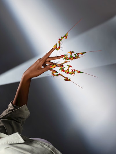 Renowned artist Mino Vo crafted the framework using copper, and expertly infusing the grid with a palette of jellies and creams, resulting in a mesmerizing multidimensional masterpiece.