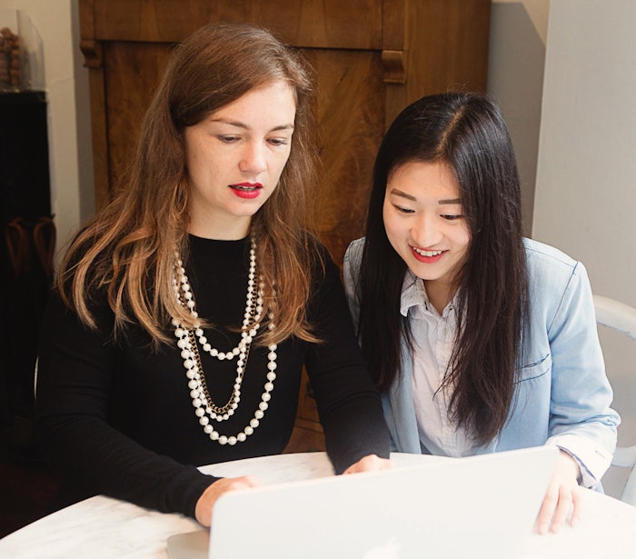 Author Ada Polla at left in 2015 with an intern. Polla writes, 'Our industry thrives on newness—we overemphasize new and underemphasize core.'