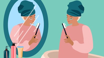 Woman brushing teeth with skin care eye patches.