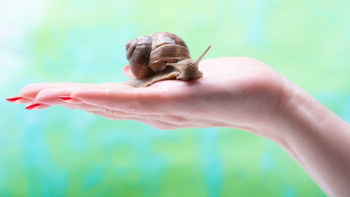 Woman Holding Snail Mucin Sunscreen Story