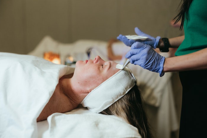 Woman receiving a Cool Peel in the spa