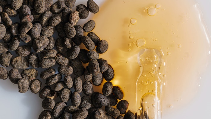 bakuchiol seeds oil spill skin care concept