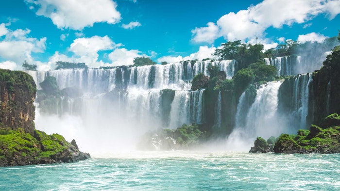 view-of-iguazu-falls-in-brazil-looking-from-river-level-misty-spray