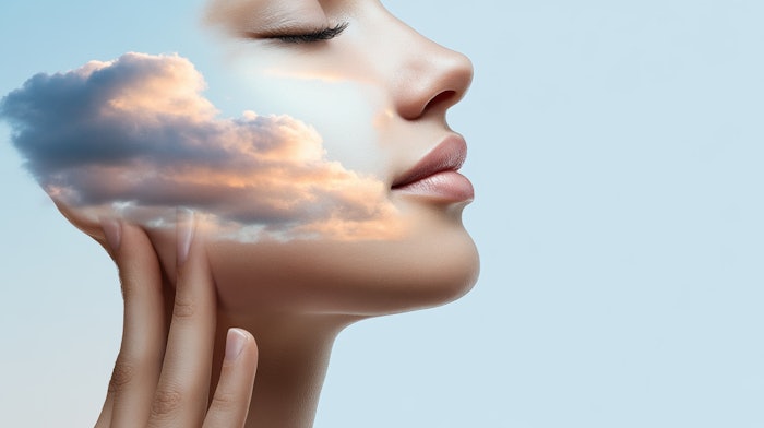 Woman touching her face with cloud cream