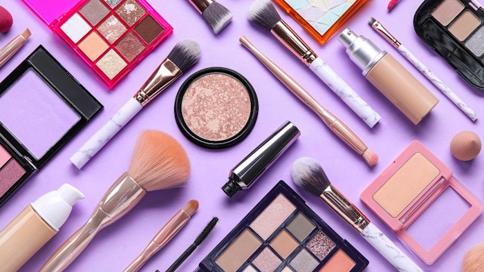 cosmetics makeup spread out mixed lilac background