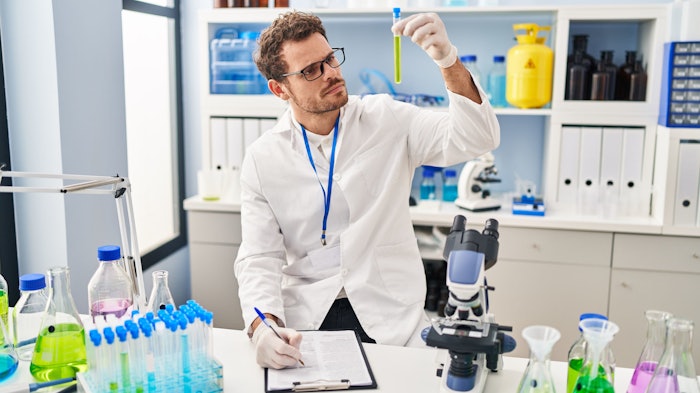 chemist in lab examine test green chemistry concept