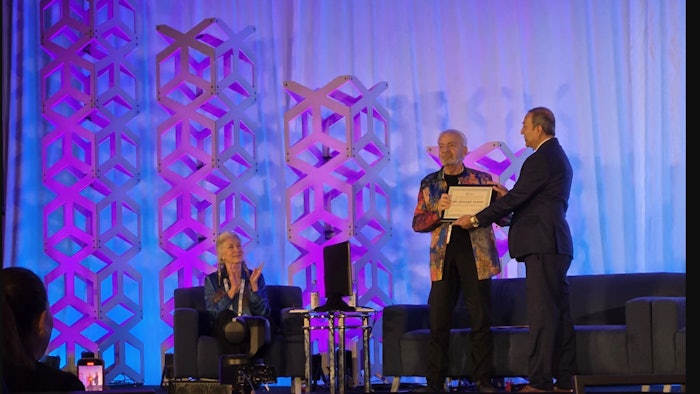 From L: Leslee Goodman, moderator, looks on as Howard Murad, M.D., receives the Frontiers of Science Award from Akshay Talati, Pharm.D.