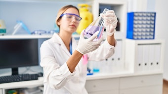 chemist in lab testing samples
