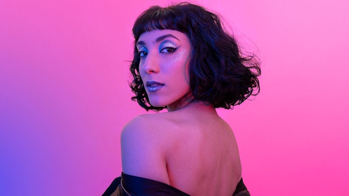 woman turned looking over shoulder soft bob haircut