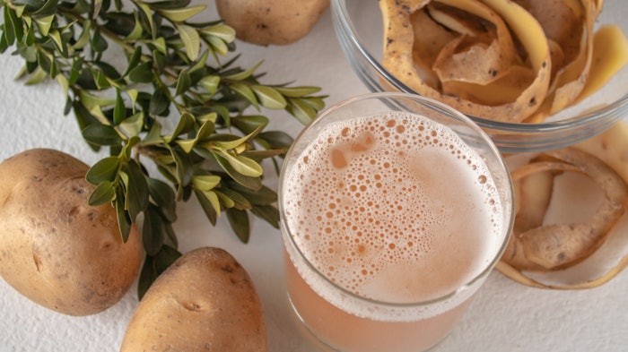 potatoes peeled juice on a table clear glass bowl