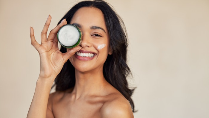 Young Brunette Beige Top Holding Jar Of Skin Cream Fun Adobe Stock 743622115