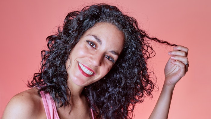 Beautiful Brunette Curly Shiny Hair Adobe Stock 425737013