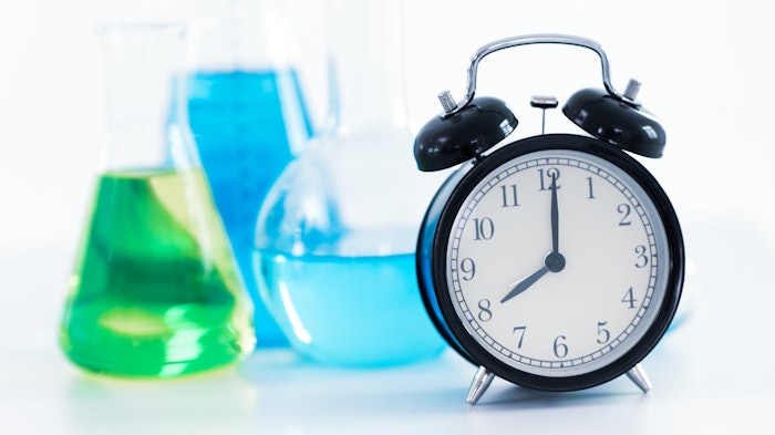 clock glassware chemistry lab colored liquids